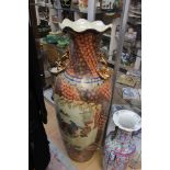 A large floor standing Japanese vase, painted with oriental figures,