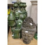 Large wooden oriental mask, together with large terracotta model of a man with lamp,