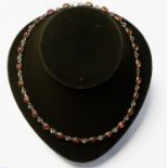 A silver and amber necklace, cabachon and link design,