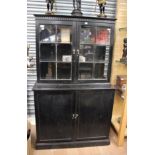 An early 20th Century oak ebonised bookcase / display cabinet, of two-tier form,