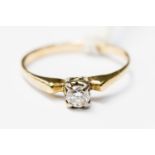 A diamond solitaire in yellow metal, probably 18ct gold, diamond weight approx 0.