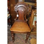 A Victorian chair with carved back