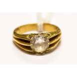 An 18ct gold and white stone ring, size N1/2, gross weight approx 6.