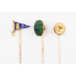 Stick pins, set in yellow and rose metal, a Scarab beetle finial, an enamel yacht dub Hag,