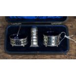 A cased silver condiment set, with blue glass liners, Chester 1922, gross weight approx 5.