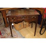 A George III oak lowboy, with two deep drawers and a central shallow drawer,