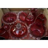 A collection of cranberry glass to include jugs,