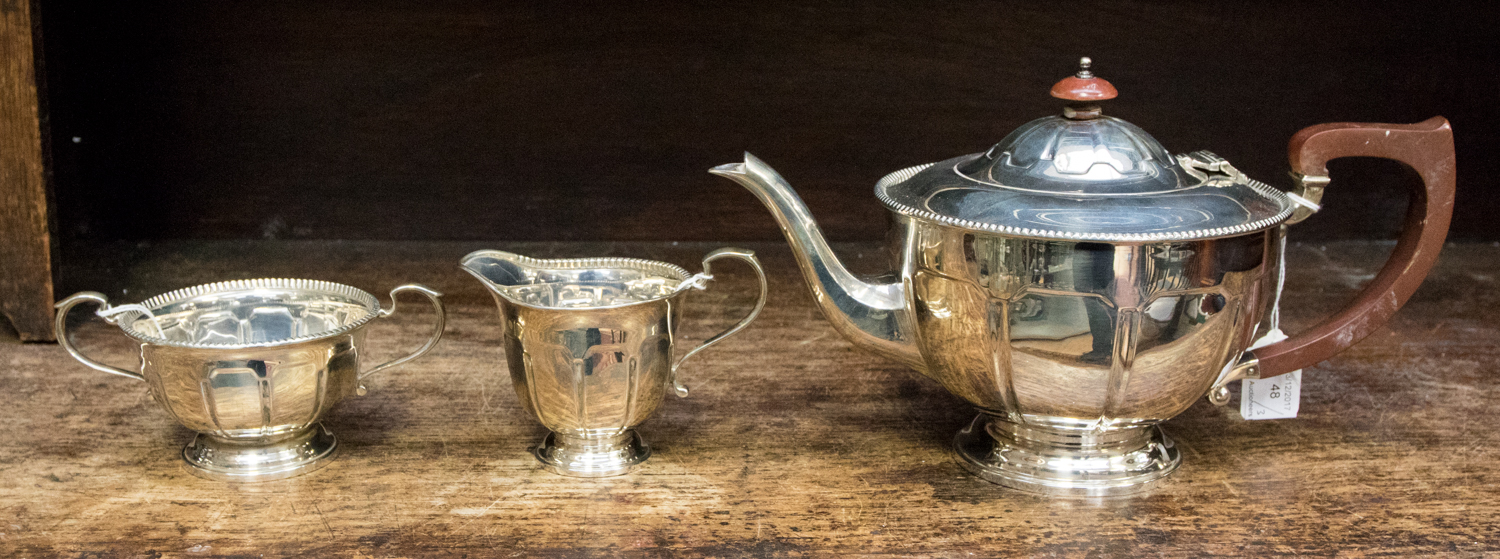 A silver three piece part tea service, Sheffield 1936, weighing in total approx 25.