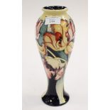 A Moorcroft first quality trial vase, Floral pattern on a cobalt and cream ground,