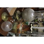 A heavy brass based oil lamp, etched glass globes, funnel,