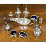 A collection of silver plated condiment pots and pepperettes and sauce boat (12 in lot)