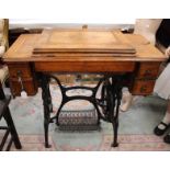 A late Victorian/Edwardian, Treadle sewing machine, a/f, electrified,