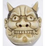 Oni mask ivory signed Japan 19th century Netsuke oni mask with long horns and evil smiling. THIS LOT