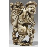 Netsuke ivory Japan, 20th century Man carrying a bag over his shoulder. On top of the bag three kids