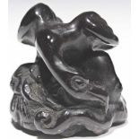 vulture eating a octopus ebony carved Japan about 1900 Vulture stretching his head towards a