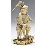 Farmer with hoe ivory, signed at the bottom Japan Meiji period, 19th century Farmer standing on