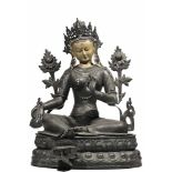 Green Tara Bronze, Tibet / Nepal End of 19th century Green Tara sits with the right leg pendant, the