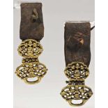 Pair of belt pendants leather and brass fire gilt Tibet 18th century Nicely cut and engraved belt