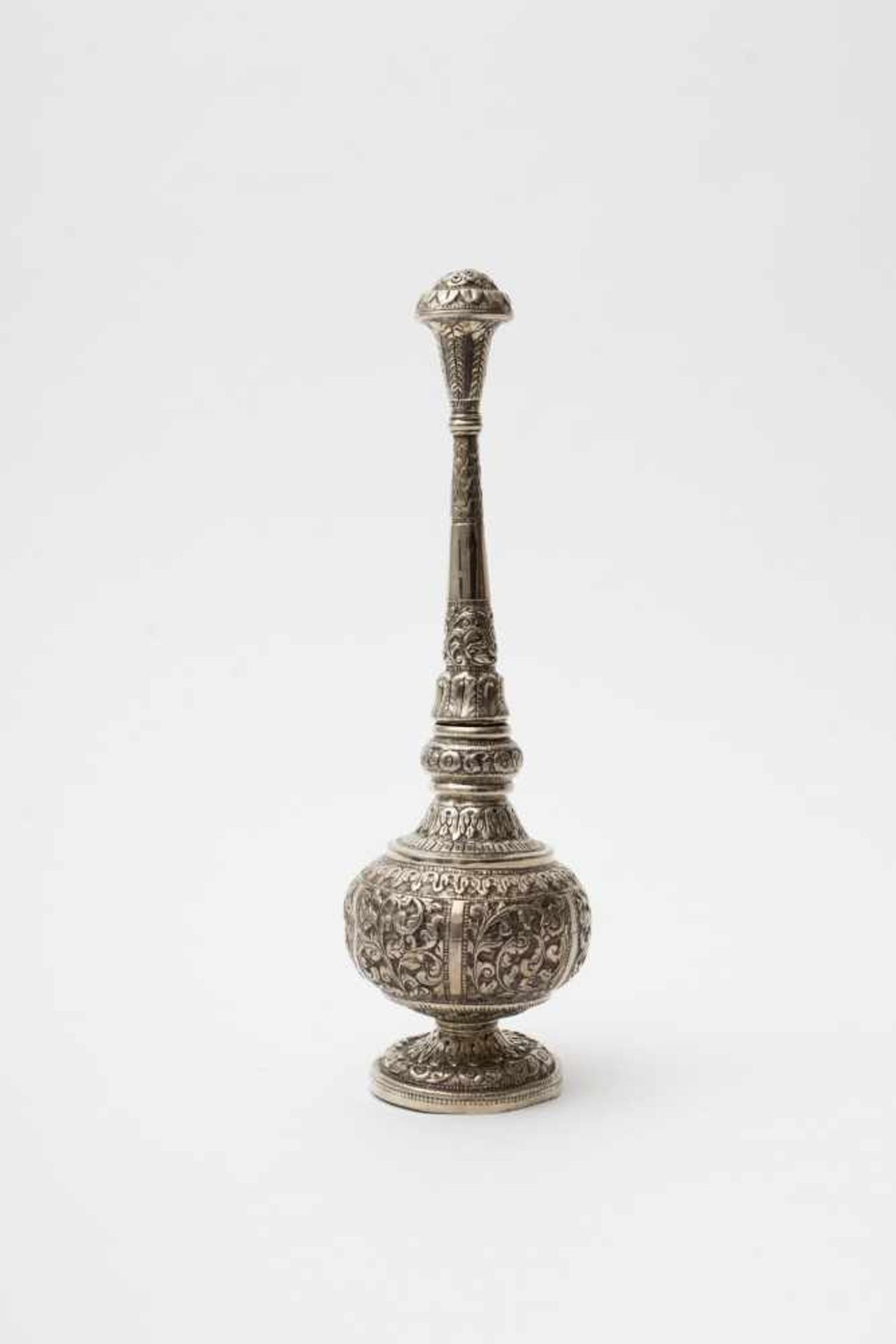 Sprinkler Silver, embossed with floral motif. Dented base. Probably Persian make. Stamp: none. Gross