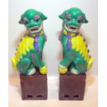 Pair Of Antique Coloured Glazed Temple Dogs Standing On Aubergine Square Bases, Height 12 Inches