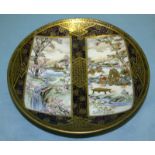 Japanese Satsuma Plate Of Fine Quality, With Two Panels Depicting Scholars Sitting By A River With