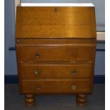 Mid 20thC Oak Bureau, Fall Front With Fitted Interior Above Three Long Drawers.