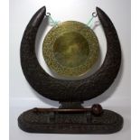 Indian Carved Hardwood Table Gong, Profusely Carved Throughout, Height 12 Inches, 11 Inches Wide.