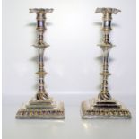 Pair Of Queen Anne Style Candle Sticks, Raised On Square Stepped Bases, Height 7.5 Inches