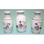 A PAIR OF CHINESE FAMILE ROSE MINIATURE VASES depicting maidens reading in a garden setting,