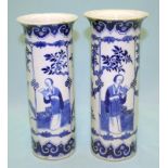 AN EARLY PAIR OF CHINESE BLUE AND WHITE SLEEVE VASES decorated with elegant ladies reading, bordered