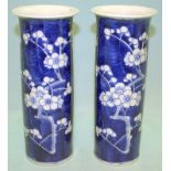 A PAIR OF ANTIQUE CHINESE BLUE AND WHITE SLEEVE VASES decorated with cherry blossom, four