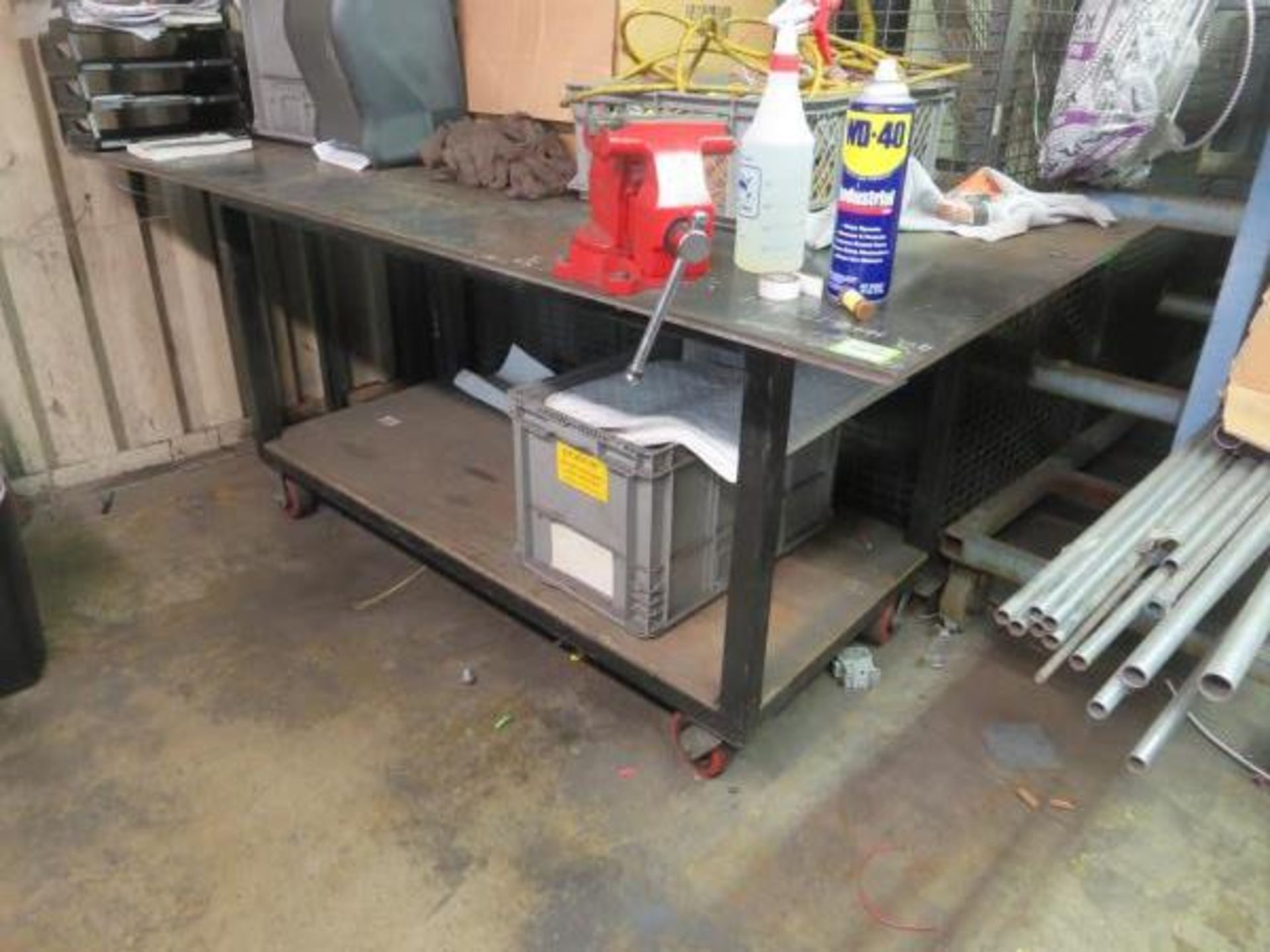 Work Bench, on casters 36" x 80" x 35 1/2"h with 5 1/2" vise. Contents on top & Bottom not