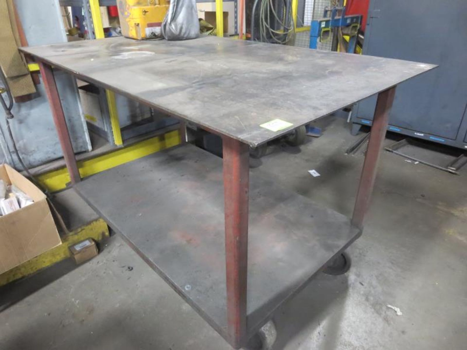 Work Bench, 64" x 38" x 40"h on casters, 1/4" steel top. Contents on top not included. Hit #