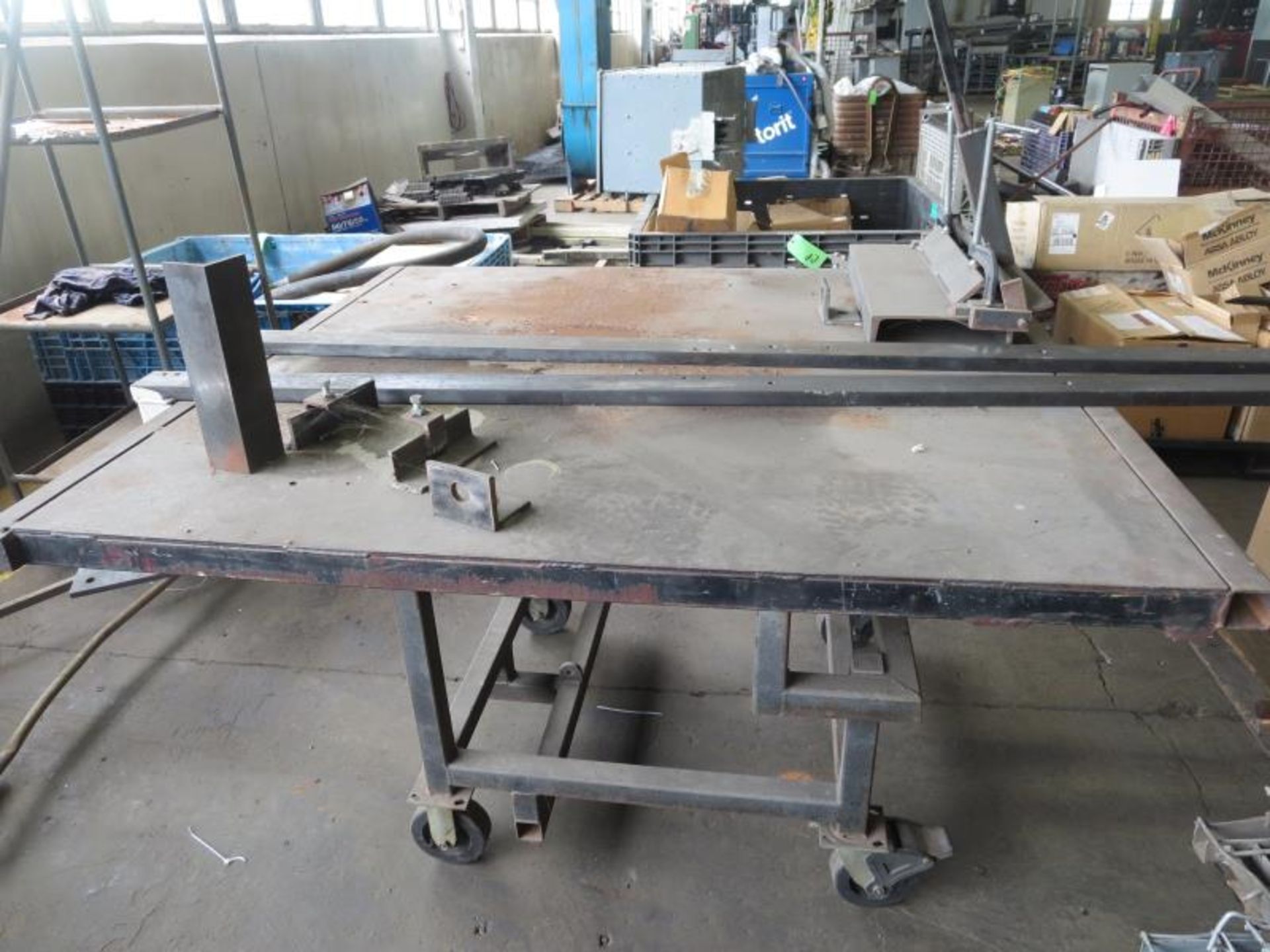 Work Shop Table on casters with custom 20" manual brake, Table 61" x 55" x 36" 1/4" plate top.