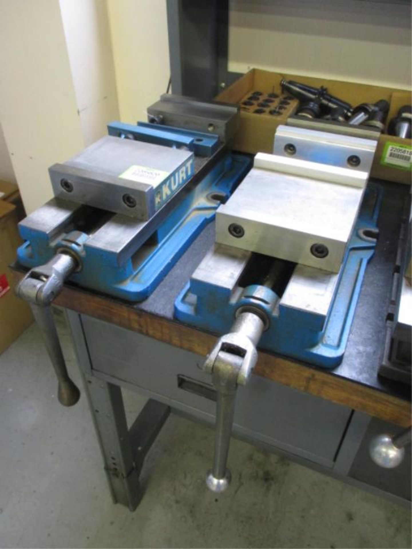 Vises. Kurt Lot: (2) 6" Angle-Lock Vises. HIT# 2205820. CNC Room. Asset Located at 859 Ward Drive,