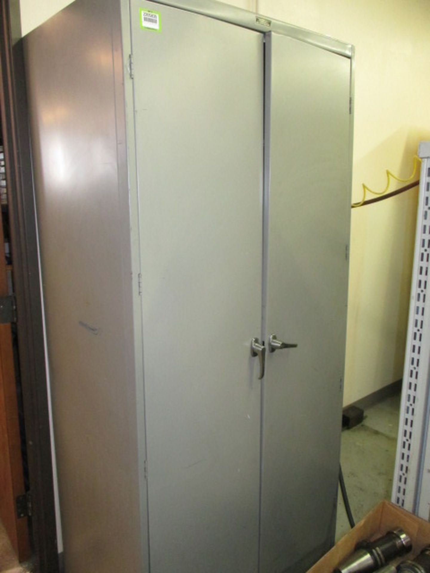 Cabinet with Contents. Storage Cabinet with Assorted Vise Jaws. HIT# 2205835. CNC Room. Asset