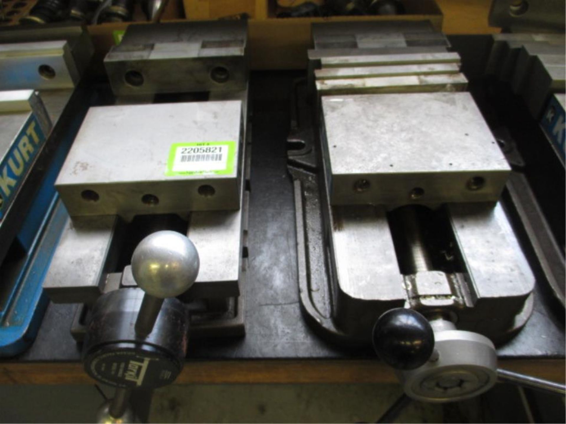 Vises. Kurt Lot: (2) 6" Angle-Lock Vises. HIT# 2205821. CNC Room. Asset Located at 859 Ward Drive,