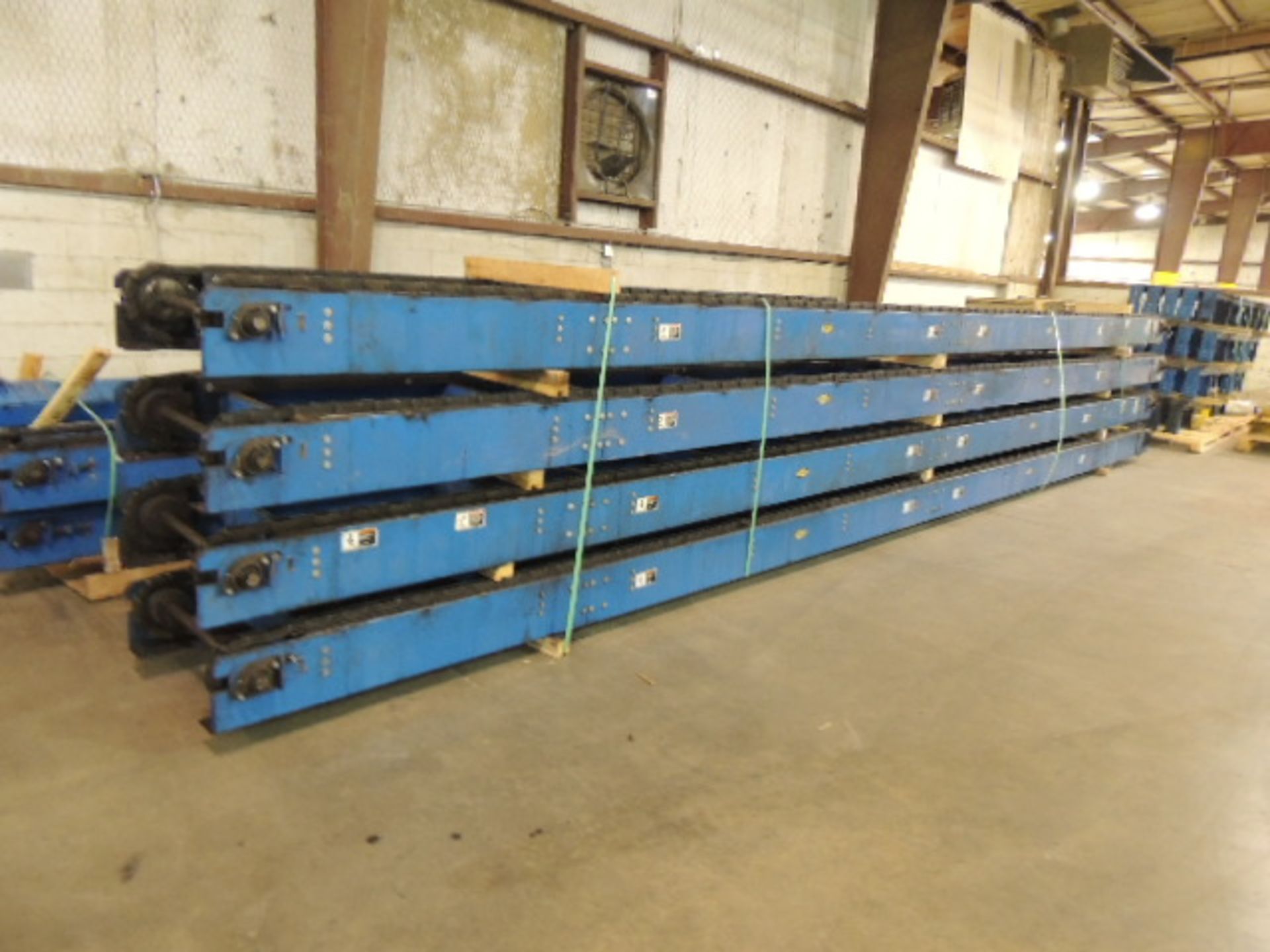 LEWCO Lot: (8) sections 30'x10"x32" chain driven conveyor, (20) 9'6" L x 9" W adjustable height