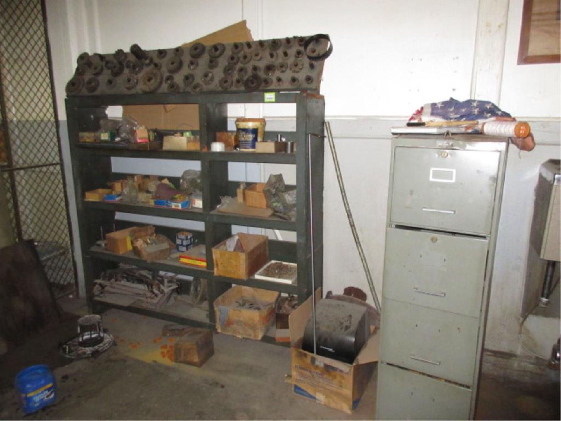 Lot Misc. Machine Parts, on rack and on one table. HIT# 2179433. basement crib area. Asset Located