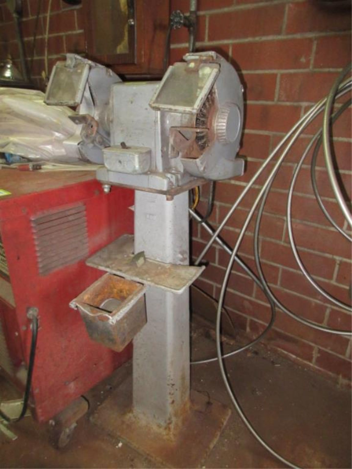 Double End Grinder/Polisher, includes pedestal, 115 VAC. HIT# 2179336. basement weld shop. Asset