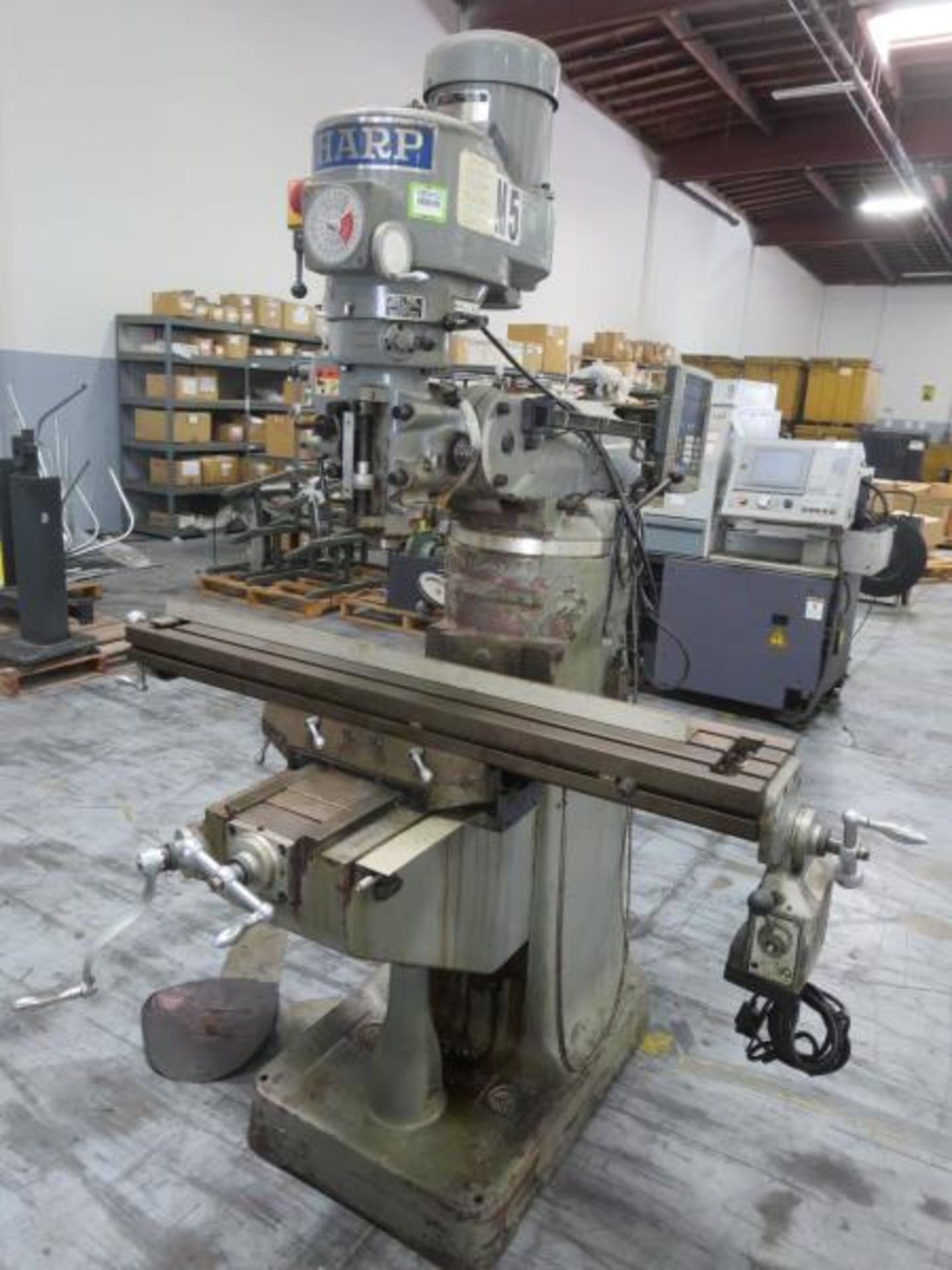 Sharp LA-56 Vertical Mill, 3 axis, 9" x 50" feed table, 90° Rotating Head, 40° Tilting head,