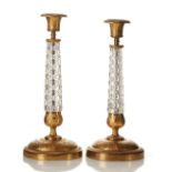 A PAIR OF CANDLESTICKS - Russia, Moscow, workshop of P.Petrov, 1830s. gilt- and [...]