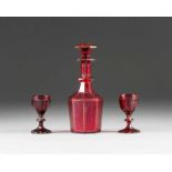 A GLASS DECANTER WITH STOPPER AND A PAIR OF BEAKERS Probably Russian, circa 1840 Colourless cut-