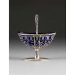 A SILVER FILIGREE FOOTED BOWL WITH HANDLE Baltic, circa 1800 With a blue glass inset, minimally