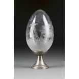 A LARGE GLASS EGG SHOWING THE CRUCIFIXION Probably Russian, circa 1900 Colourless glass with