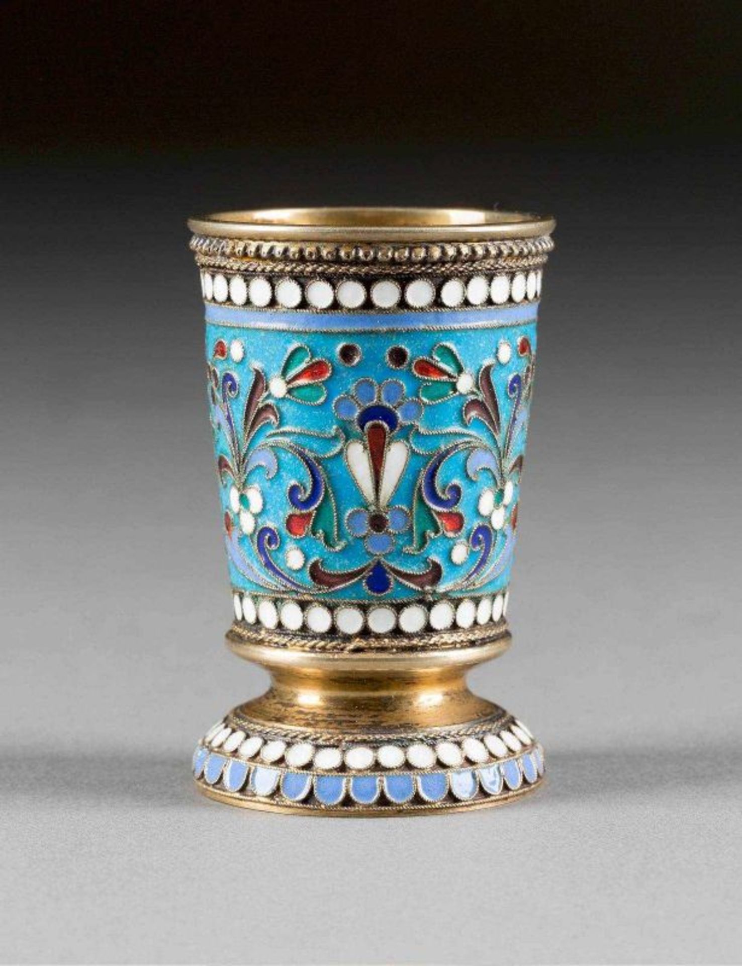 A SILVER-GILT AND CLOISONNÉ ENAMEL BEAKER Russian, Moscow, Ivan Saltykov, 1892 The body decorated