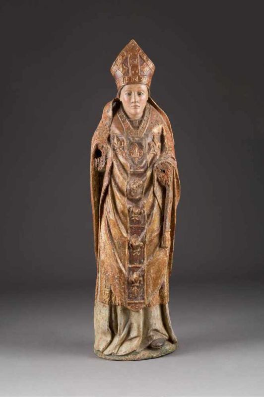 FIGUR EINES HEILIGEN BISCHOFS Frankreich, Burgund, um 1400. Holz, plastisch geschnitzt, rückseitig