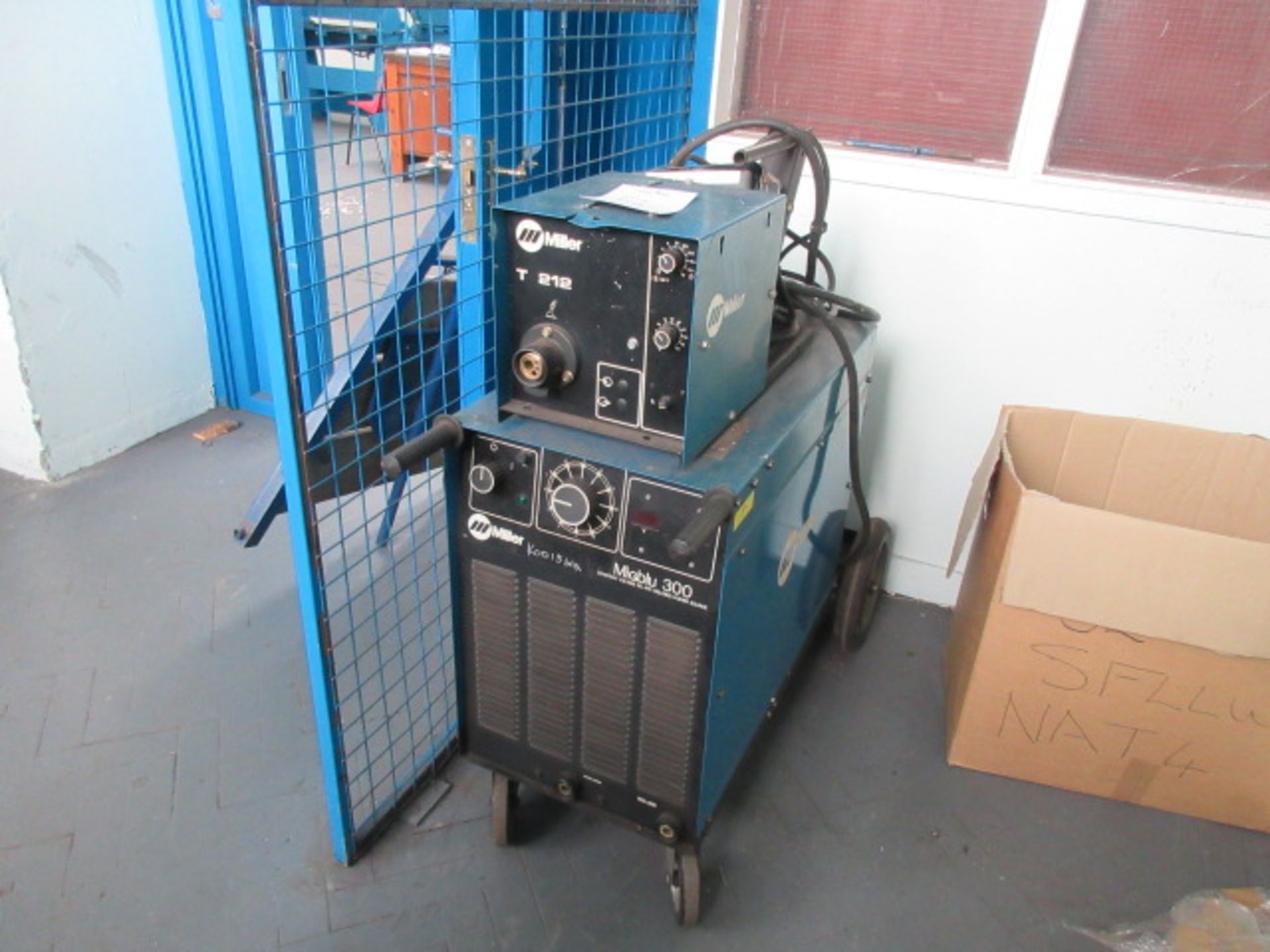 Miller MigBlu 300 constant voltage DC arc welding power source with T212 wire feed unit. No torch or