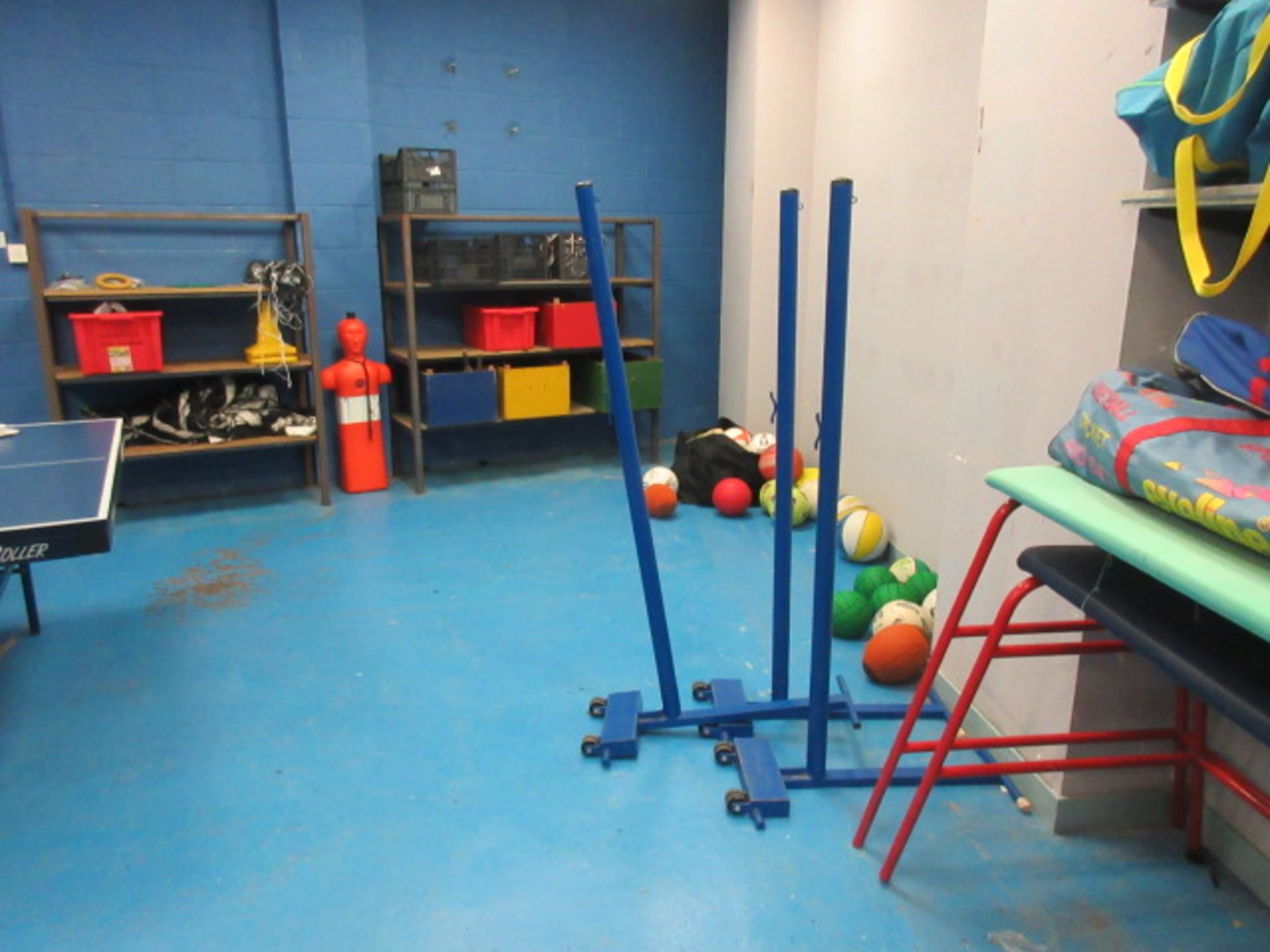 Various Sports Hall Equipment. To include Badminton nets and stands. Indoor hockey sticks and balls.