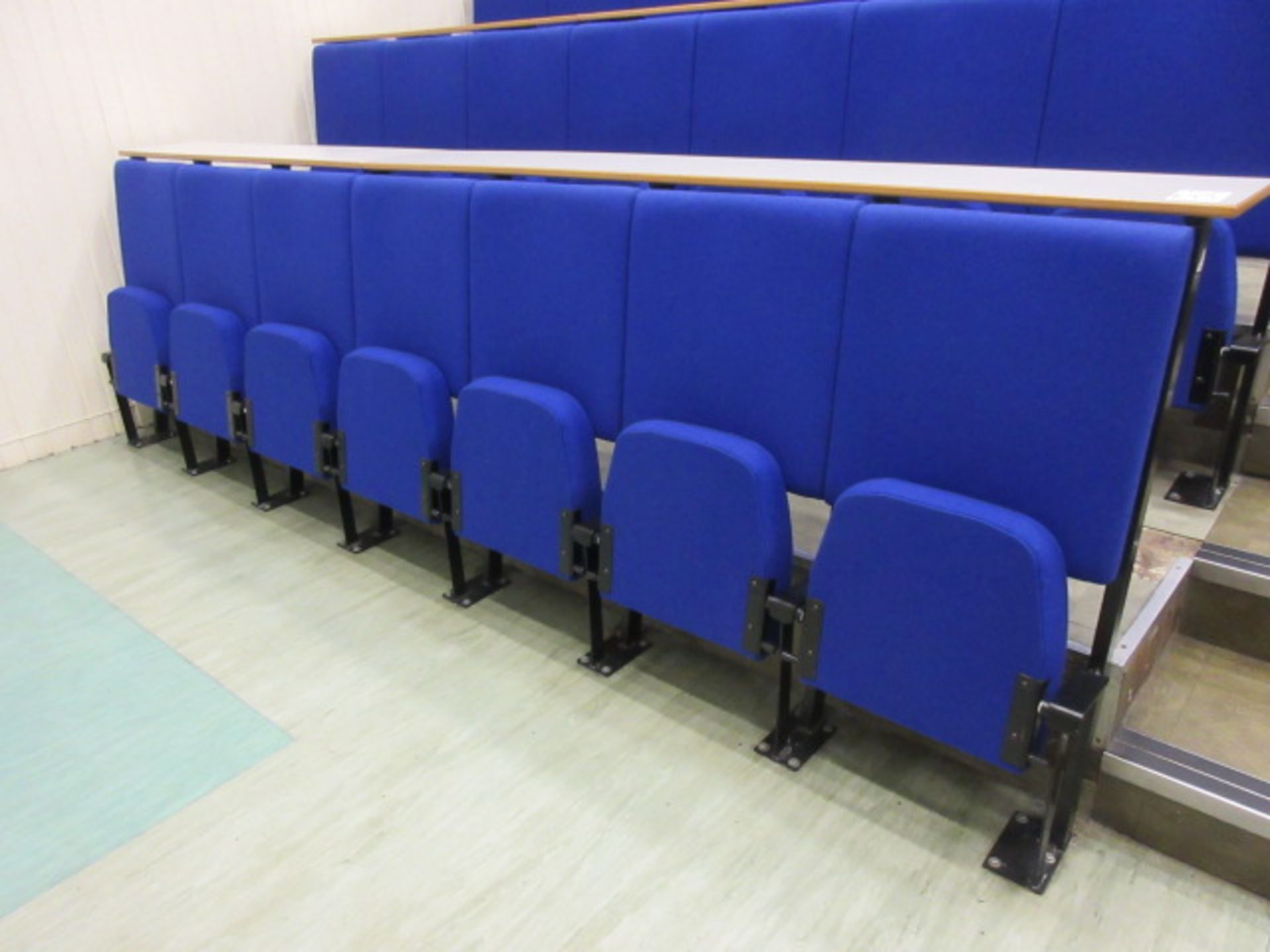 Lecture Theatre Seating. Row of 7 pull seating. Blue cloth upholstered Holehouse Road. Ground